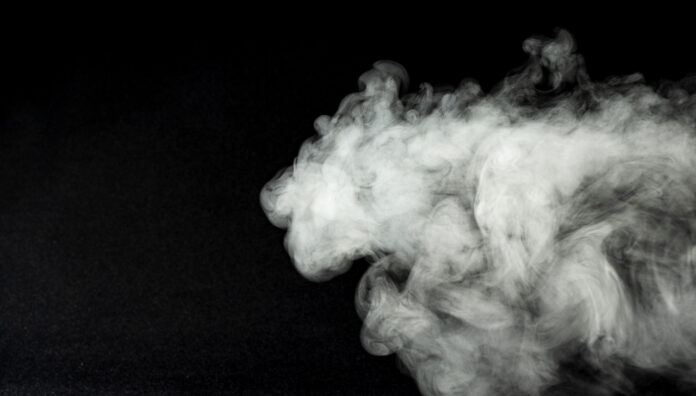 VAPE smoke White vapor smoke against a black background, illustrating vaping in the context of vaping laws changes