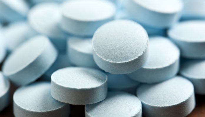 Heap of Blue pills close up