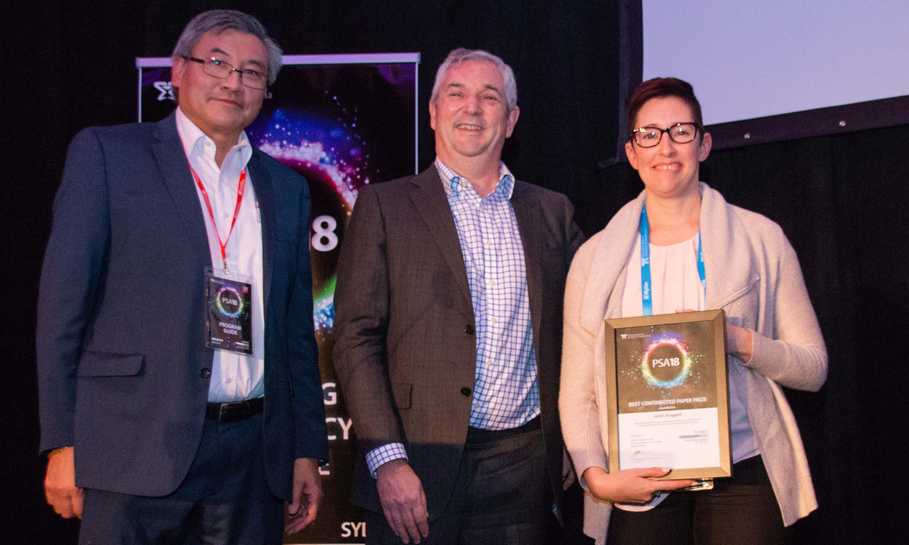 Dr Janet Sluggett from Monash University accepting the Best Paper Prize