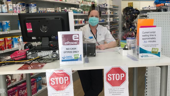 practical-ways-respond-covid-19-feature A triage desk at Capital Chemist Southlands prevents customers from entering the pharmacy
