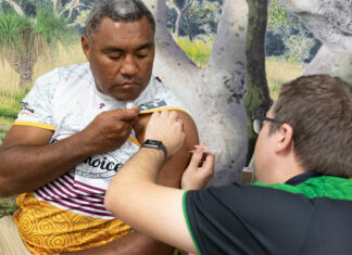 Pharmacists involved in COVID-19 vaccine Phase 1b rollout Deadly Choices Ambassador Petero Civoniceva receives his vaccine from pharmacist Matthew Hoy MPS