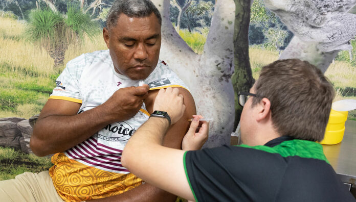Deadly-Choices-Ambassador-Steve-Renouf-recieve-his-vaccination-from-pharmacist-Matthew-Hoy-feature Queensland pharmacist Matthew Hoy MPS has been administering COVID-19 vaccinations since March.