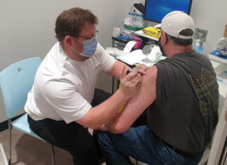 Free influenza vaccine update Dale Richardson MPS administering his first COVID-19 vaccine on the NSW Central Coast