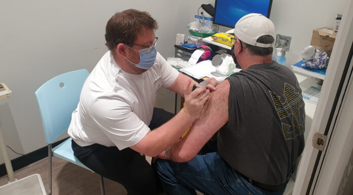 Queensland leads the way for COVID-19 vaccination in pharmacies Dale Richardson MPS administering his first COVID-19 vaccine on the NSW Central Coast