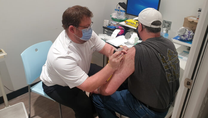 queensland-vaccine-rollout-feature Dale Richardson MPS administering his first COVID-19 vaccine on the NSW Central Coast