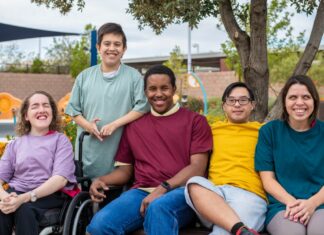 Making medicine safer for people with intellectual and developmental disability A group of people with intellectual and developmental disabilities engaging happily outdoors, highlighting the importance of clinical support in making medicine safer