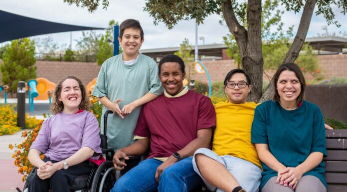 Bridging healthcare gaps for people with intellectual disability A group of people with intellectual and developmental disabilities engaging happily outdoors, highlighting the importance of clinical support in making medicine safer