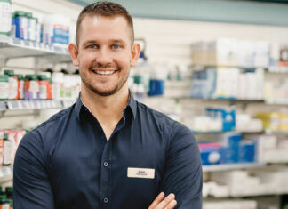 Meet Sean Richardson, the regional locum pharmacist Sean Richardson, regional locum pharmacist, smiling in a pharmacy setting