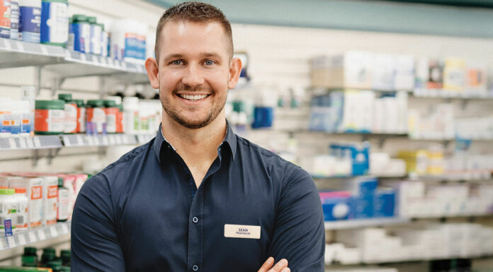Meet Sean Richardson, the regional locum pharmacist Sean Richardson, regional locum pharmacist, smiling in a pharmacy setting