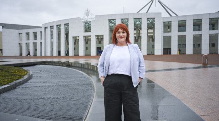 From the sunshine state to the capital ACT Pharmacist of the Year standing outside the Australian Parliament House in Canberra