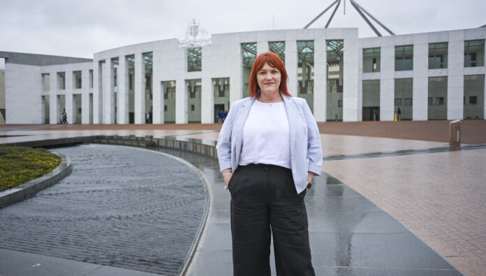 Z72_8057 ACT Pharmacist of the Year standing outside the Australian Parliament House in Canberra