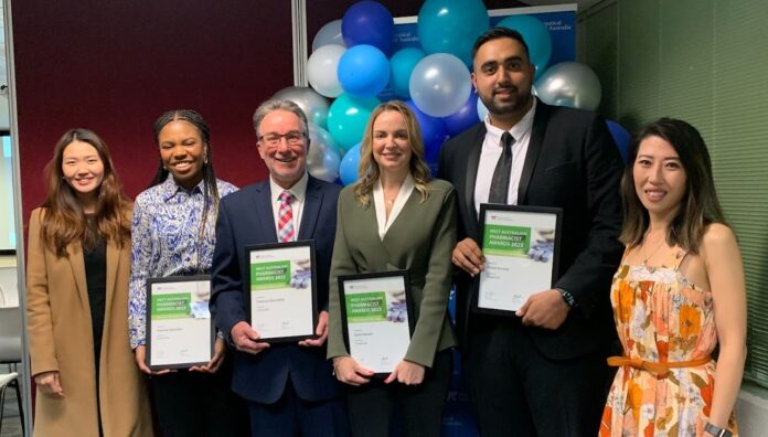 unnamed-1 Four outstanding WA pharmacists holding awards, standing with two colleagues at a celebration event