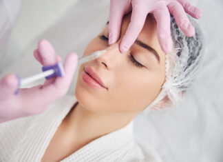 Are pharmacists the next cosmetic injectors? Calm female patient undergoing injectable beauty procedure