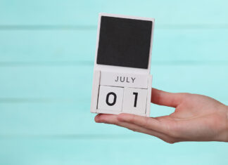 Mid-year pharmacy policy overhaul begins Hand holding a calendar showing July 1, marking the start of the pharmacy policy overhaul