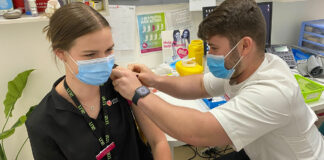 Okhan Atasoy MPS vaccinating a fellow intern