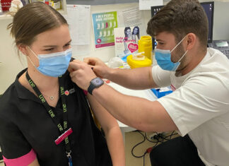 Okhan Atasoy MPS vaccinating a fellow intern