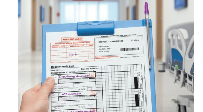 Pharmacist holding a folder and sheet.