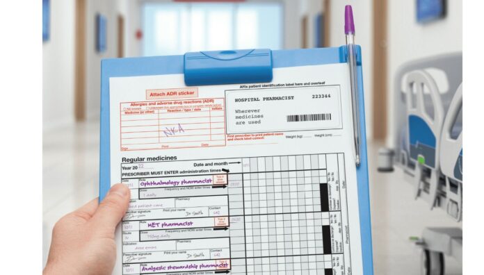 Pharmacist holding a folder and sheet.