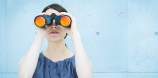 woman holding binoculars