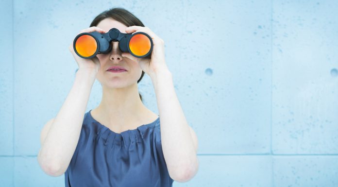 woman holding binoculars