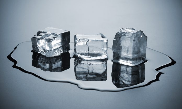 three melting ice cubes