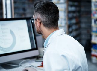 pharmacist using a computer