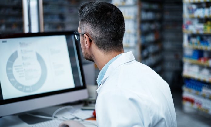 pharmacist using a computer