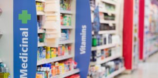 pharmacy shelves showing medicines and vitamins