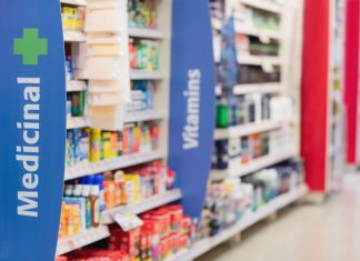 pharmacy shelves showing medicines and vitamins