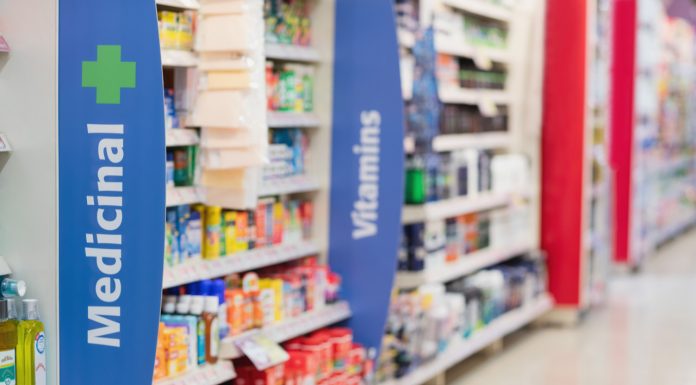 pharmacy shelves showing medicines and vitamins