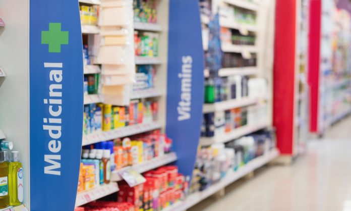 pharmacy shelves showing medicines and vitamins