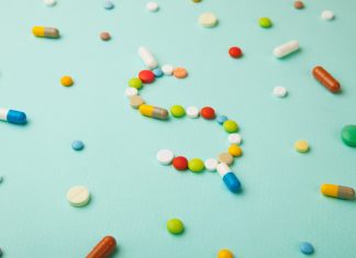 pills arranged in dollar sign