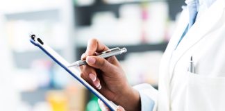 pharmacist holding clipboard and pen