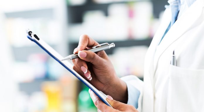 pharmacist holding clipboard and pen