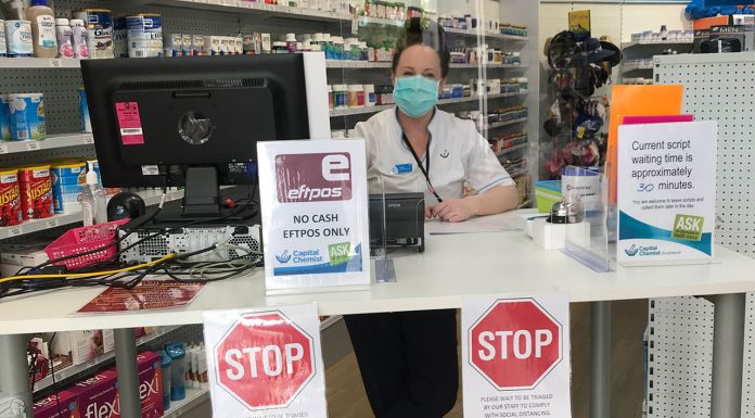 A triage desk at Capital Chemist Southlands prevents customers from entering the pharmacy