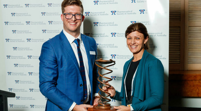 Bridget Totterman MPS (right) receives her award from PSA Queensland Branch President Shane MacDonald
