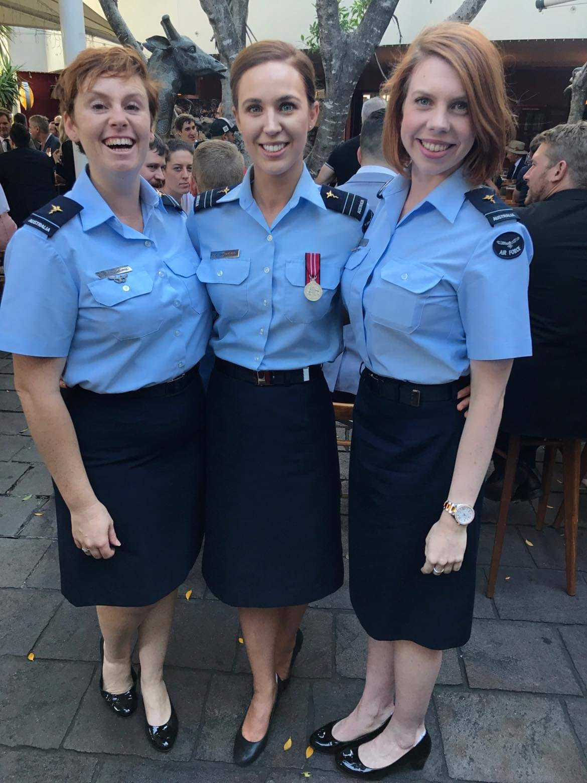 FLTLT Jones (right) with colleagues after the 2018 Anzac Day march in Brisbane.