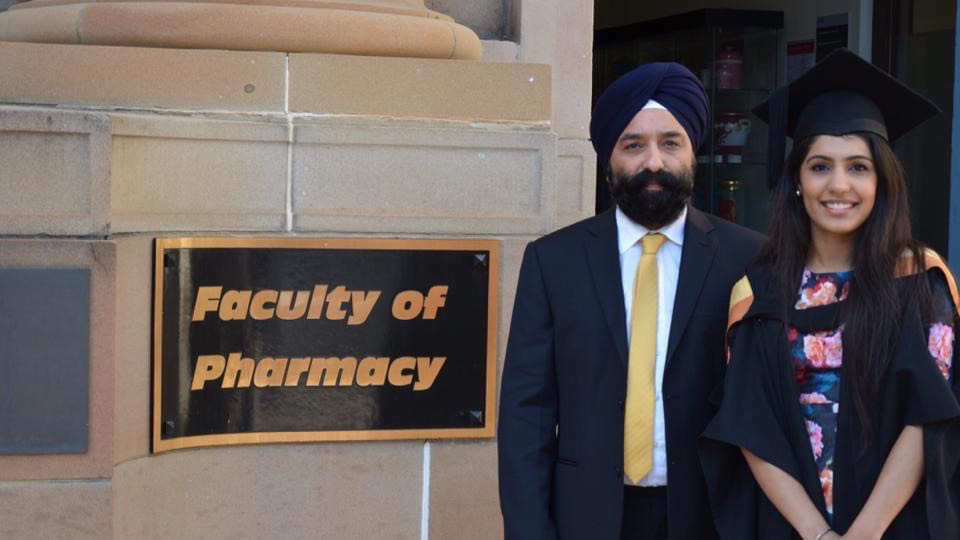 Depinder Chhibber MPS with her dad after graduating from the University of Sydney.