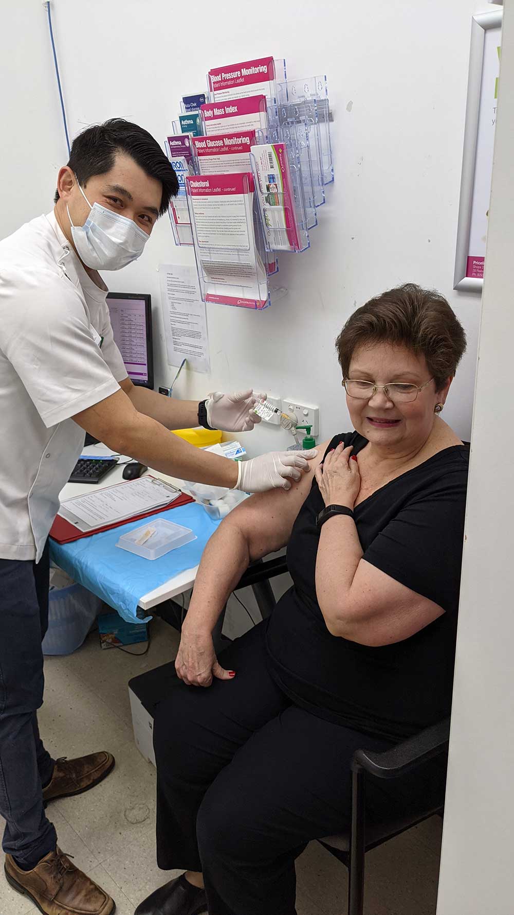 Perth pharmacist Mr Wong vaccinating a patient