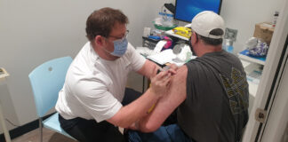 Dale Richardson MPS administering his first COVID-19 vaccine on the NSW Central Coast
